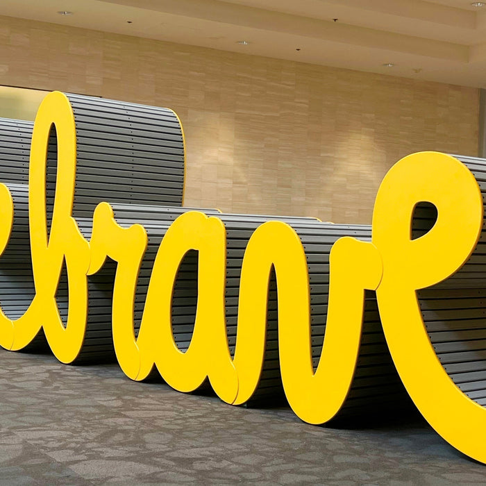 Large yellow Be Brave sculpture by Matthew Hoffman installed at Fashion Show Mall in Las Vegas, Nevada.