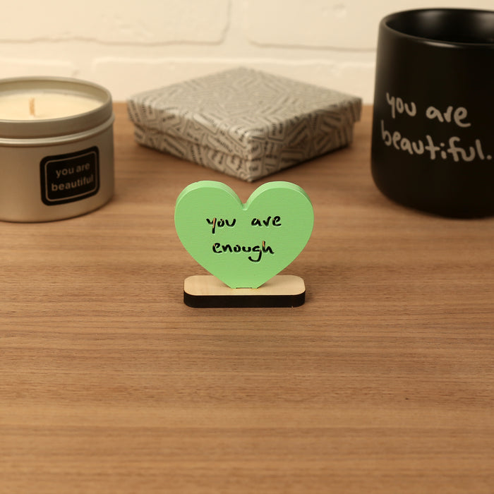 Heart-shaped Valentine mini sculpture with the phrase “you are enough,” styled as a small desk or shelf gift.