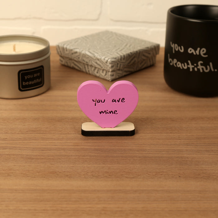 Heart-shaped Valentine mini sculpture with the phrase “you are mine,” styled as a small desk or shelf gift.